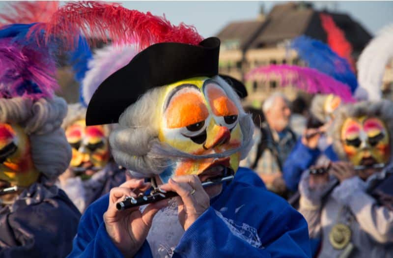 A group of Waggis playing the piccolo at Basel Carnival in Switzerland.