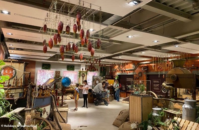 Visitors browse the exhibitions inside ChocoWelt at Aeschbach Chocolatiers in Root, Switzerland