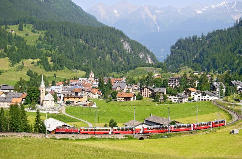 The Bernina Express passing the Swiss village of Bergun