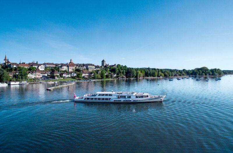 A boat cruising on Lake Murten in Switzerland