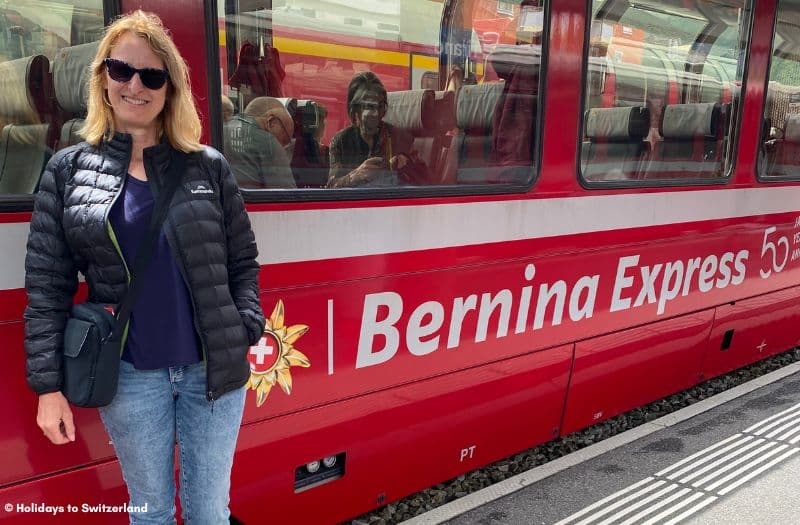 Carolyn from Holidays to Switzerland stands in front of the Bernina Express