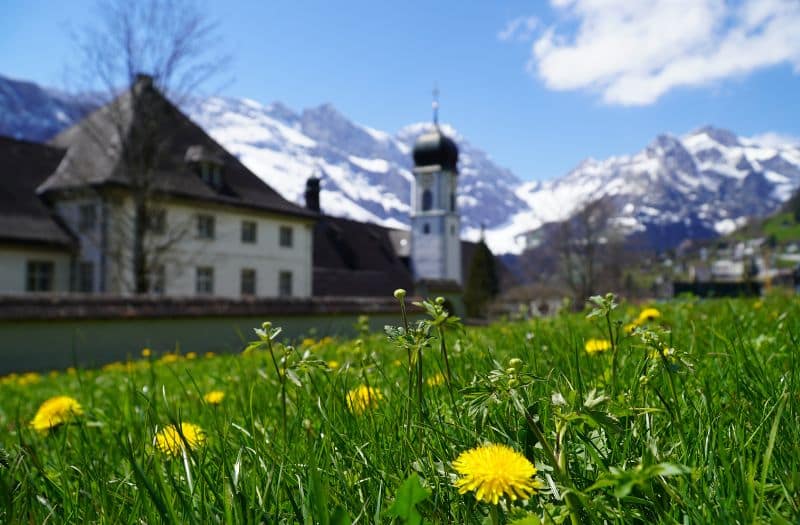 Church in Engelberg Switzerland with mountains in the background