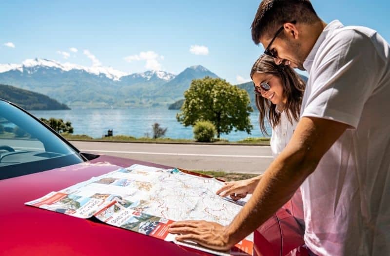 Couple looking at Grand Tour of Switzerland Map