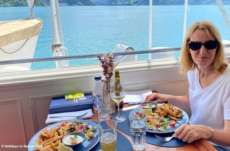 Women dining onboard a boat on Lake Lucerne, Switzerland.