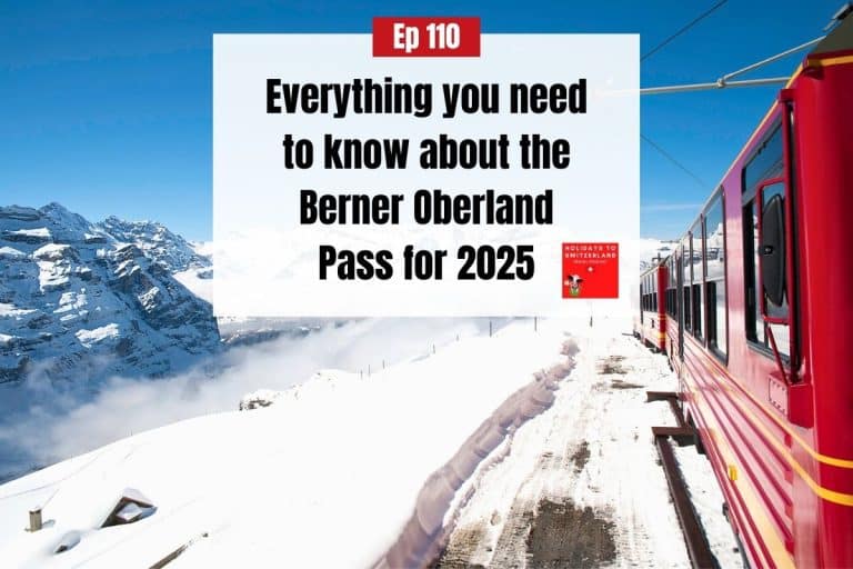 A red train travels through a snowy landscape in Switzerland