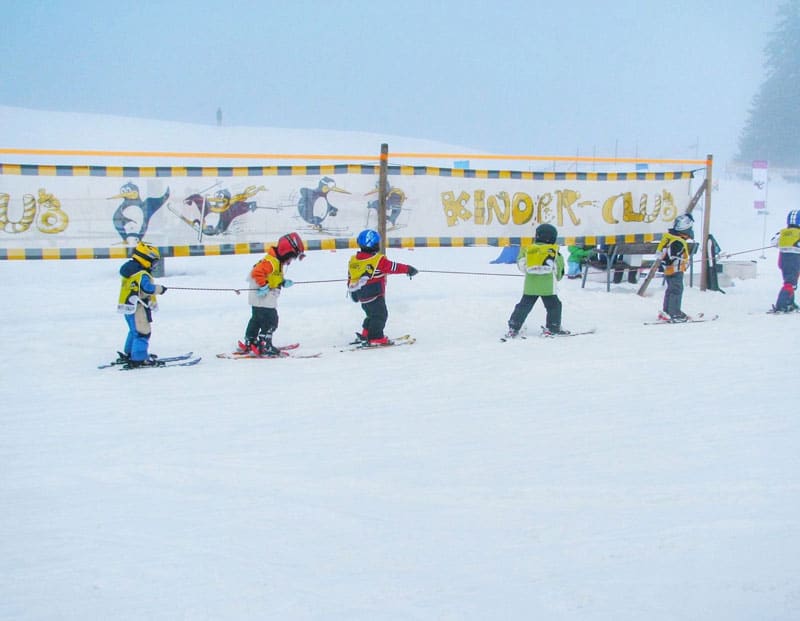 Children enjoy a ski lesson at Flumserberg in Switzerland