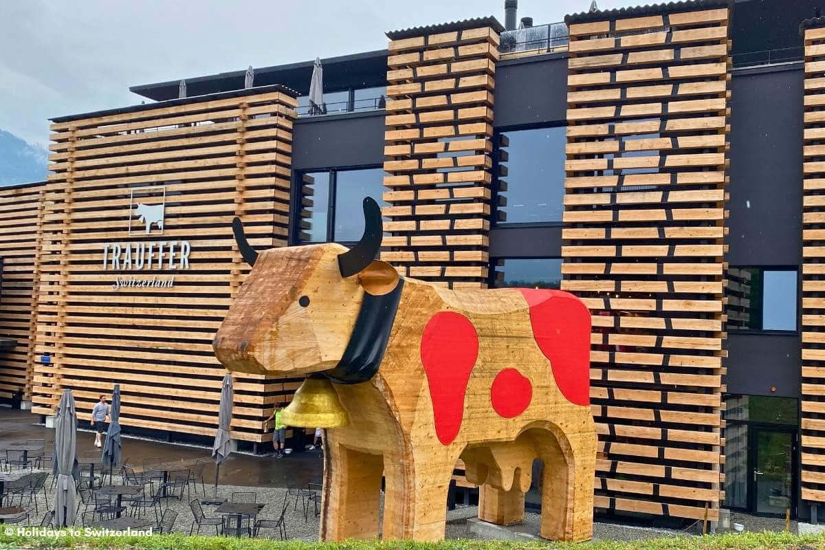 Giant wooden cow outside Trauffer World of Experiences in Hofstetten am Brienz, Switzerland