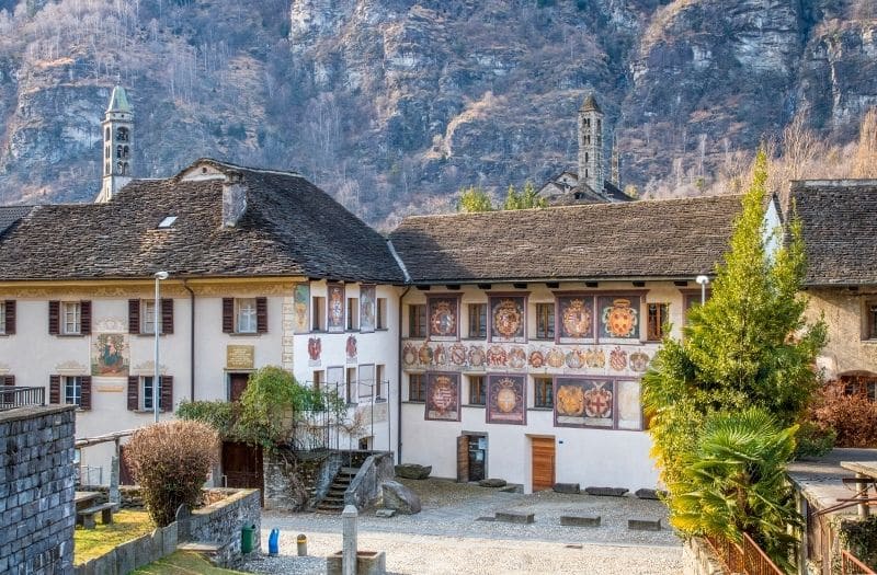 Frescoes adorn an historic building in Giornico Switzerland