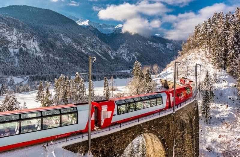 Glacier Express crossing a bridge in winter