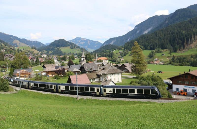 GoldenPass Express train travelling through the Swiss countryside.