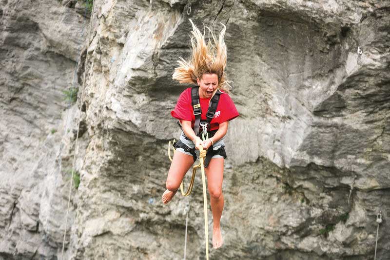 Girl screaming as she falls through the air on the Grindelwald Canyon Swing.