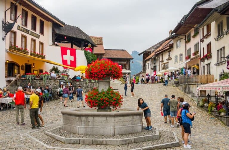 A fountain adorns the village centre in Gruyeres, Switzerland.