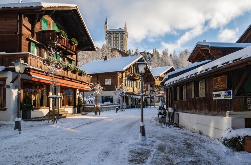 Chalet line a street in Gstaad, Switzerland in winter