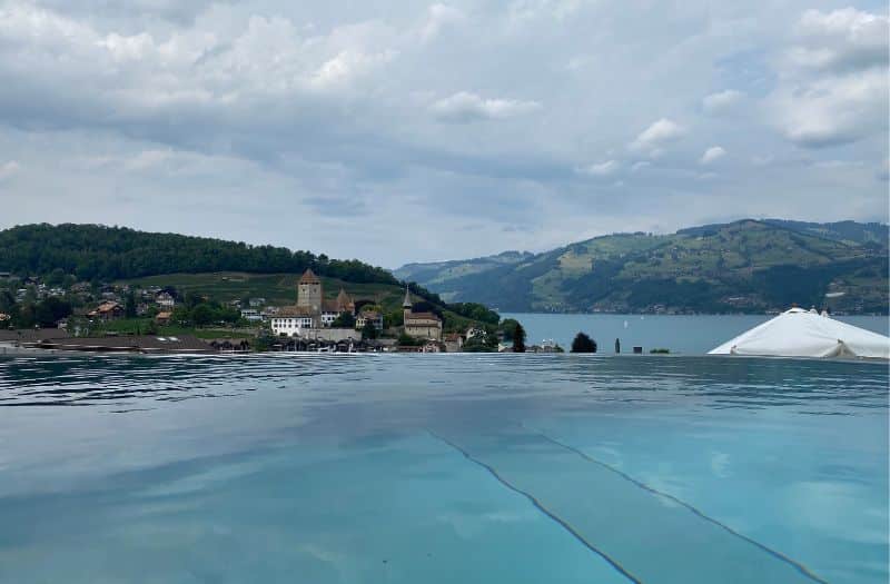 The Belvedere Strandhotel's inifinity pool looks towards Spiez Castle and Lake Thun.