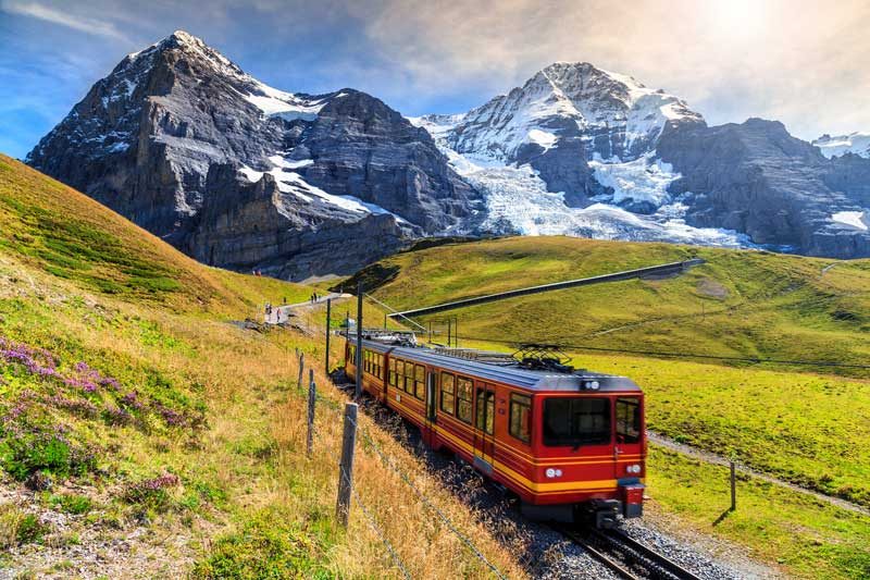 Jungfraubahn traveling through Swiss Alps.