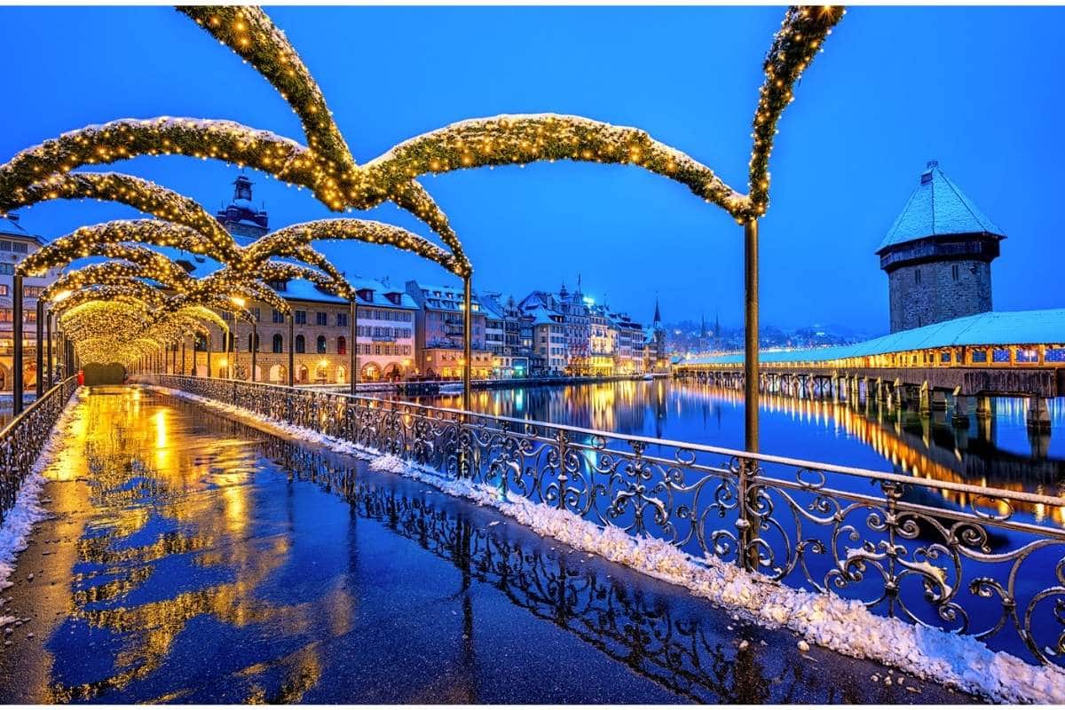 A bridge in Lucerne, Switzerland decorated with Christmas lights