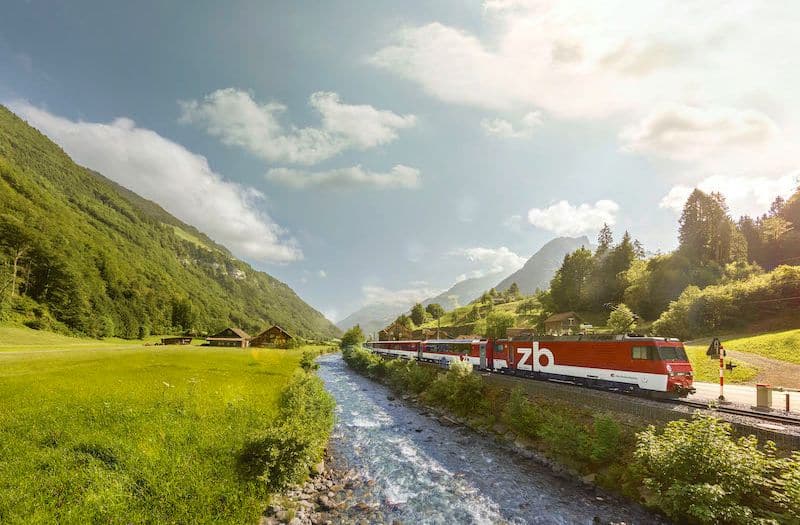 A Zentralbahn train travels beside a river between Engelberg and Lucerne.