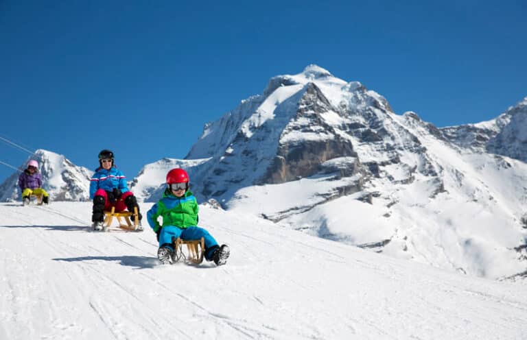 Family sledding at Murren in Switzerland