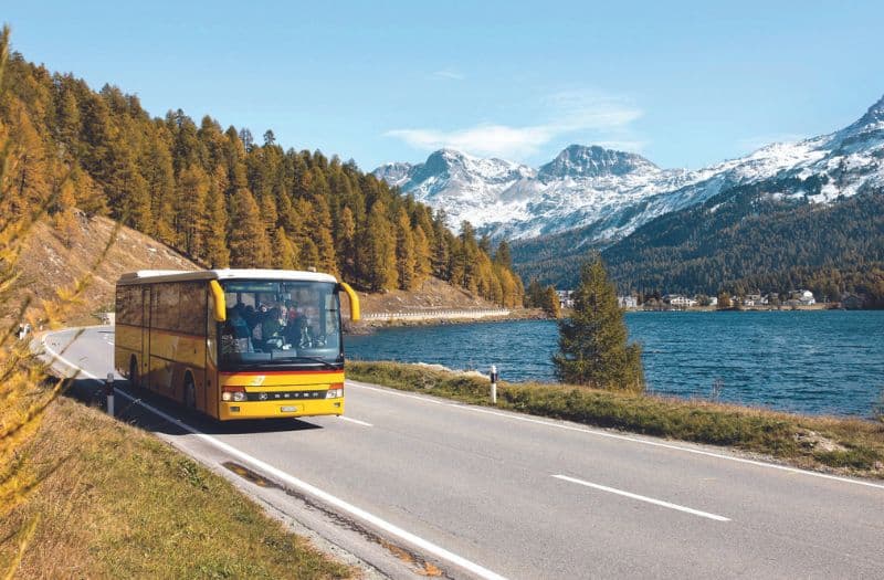 PalmExpress PostAuto bus beside Lake Sils in Switzerland