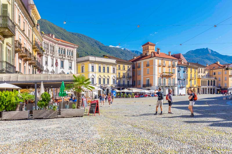 Colourful buildings line the Piazza Grande in Locarno Switzerland