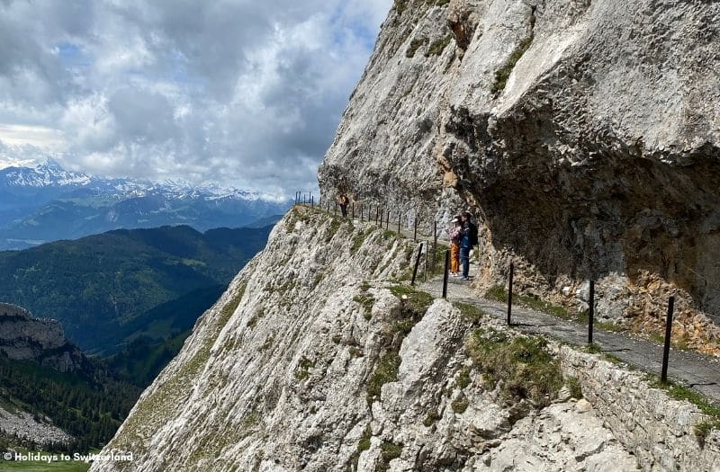 Two people on a hiking trail on Mt. Pilatus