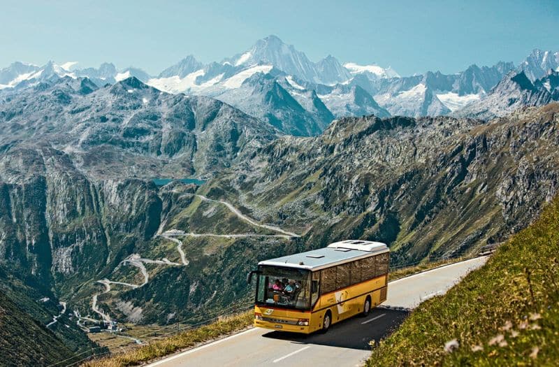 PostAuto bus on Central Alps Passes scenic route in Switzerland