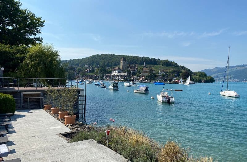 View of Lake Thun and Spiez Castle from the private lido of Belvedere Strandhotel in Spiez, Switzerland