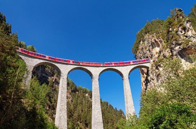 Rhaetian Railways regional train crossing the Landwasser Viaduct