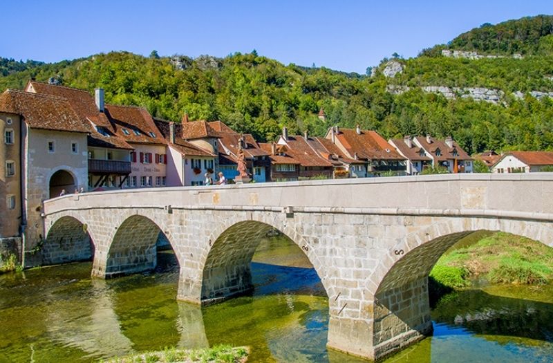 Historic bridge over the River Doubs in Saint-Ursanne, Switzerland