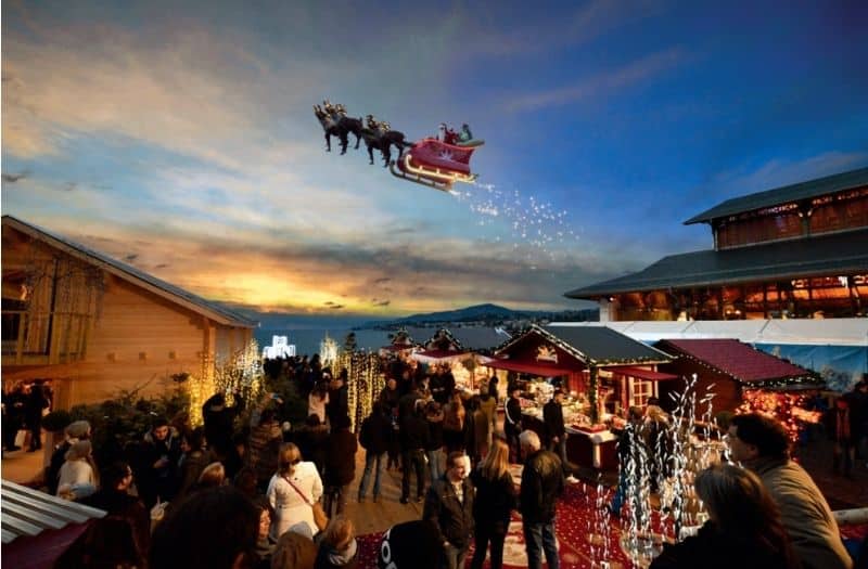 Santa's sleigh flying above Lake Geneva and Montreux Christmas Market