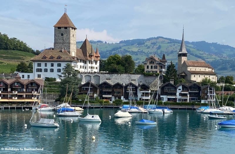 Spiez Castle overlooks boats moored on Lake Thun