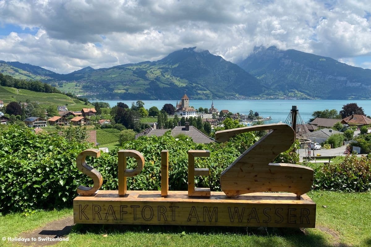 Spiez sign overlooking castle and lake