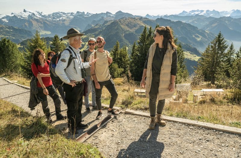 A ranger talks to visitors at Mt. Stanserhorn