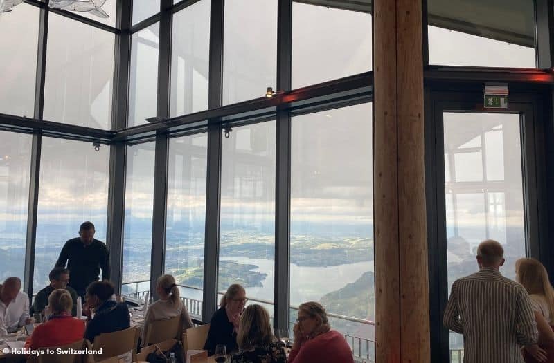 Guests dine in the revolving restaurant at Mt. Stanserhorn with views of Lake Lucerne.