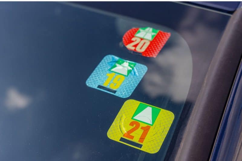 Swiss road tax stickers stuck to the windscreen of a car