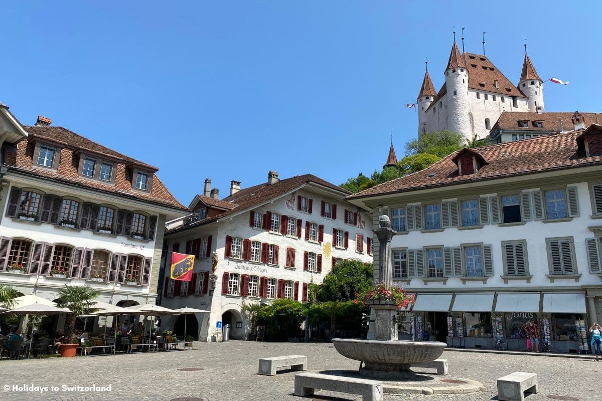 Thun Castle overlooking a square in the town of Thun