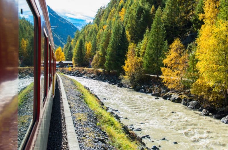 Train beside river en route to Zermatt in Switzerland