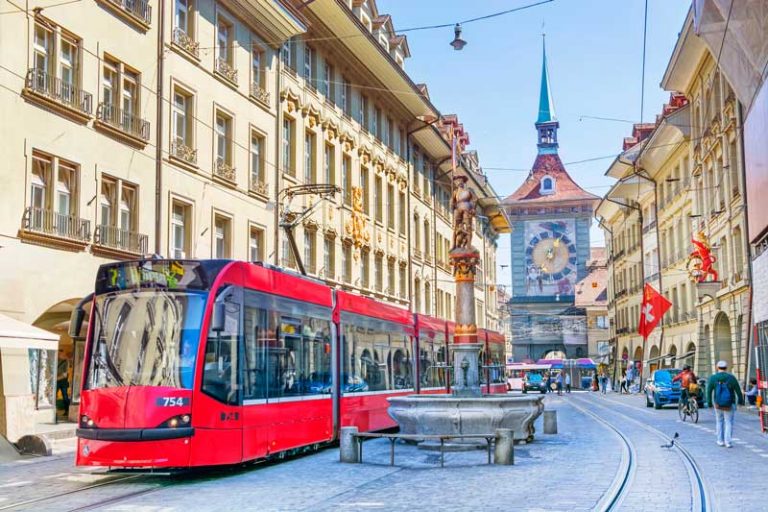 Tram in Bern, Switzerland with the Zytglogge clock tower