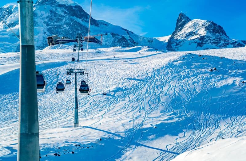 View of cable car to Klein Matterhorn Station with the ski track on the snow at Zermatt Village in Switzerland