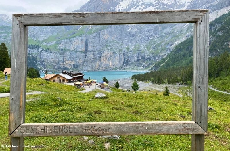 View of Oeschinensee through a wooden frame.