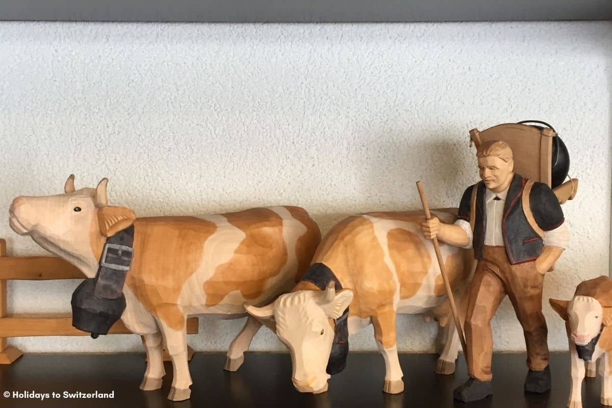 Cows and farmer carved from wood on display in a museum in Brienz, Switzerland