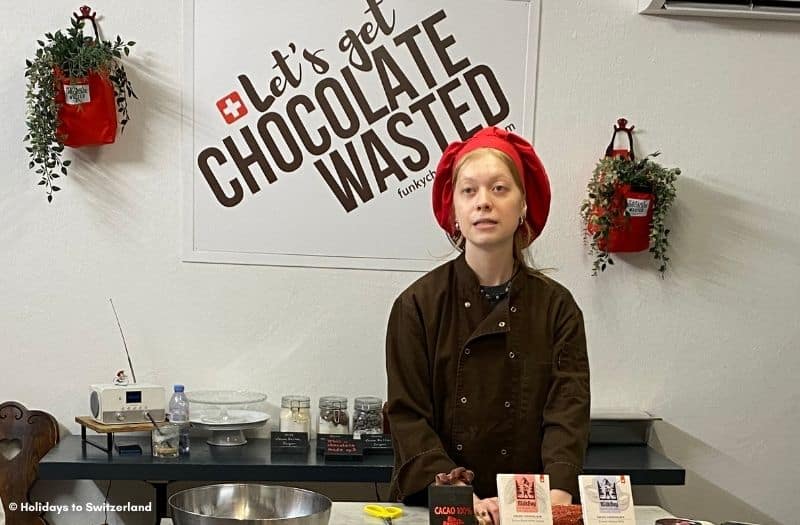 Woman instructing a chocolate making workshop at Funky Chocolate Club in Interlaken, Switzerland