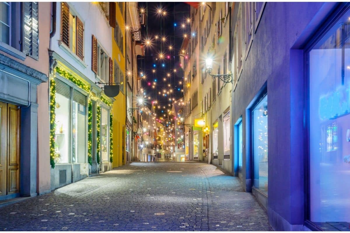 A street in Zurich's Old Town decorated with Christmas lights.